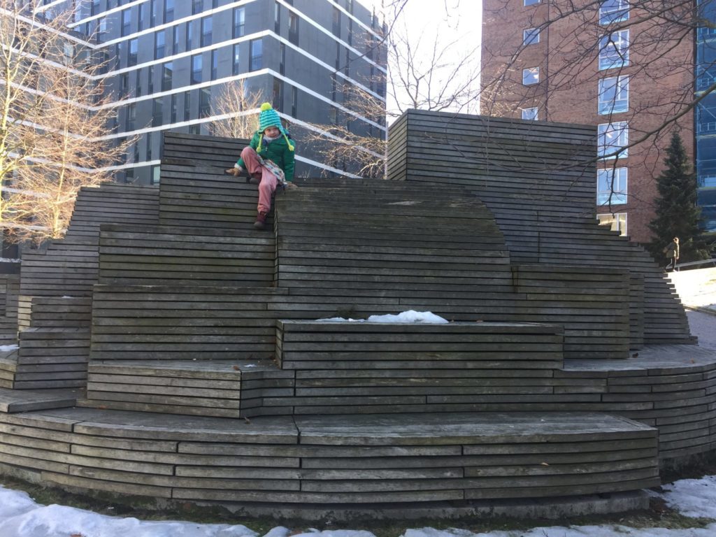 Helena climbing a kid-friendly public art sculpture